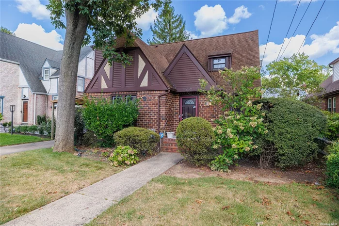 Come inside this warm, charming Tudor House. On the first floor, you&rsquo;ll find a lovely large living room with hardwood floors, a fireplace, and a dining room. Eat-in Kitchen, one large bedroom, full bath, and den, which leads out into a closed-in porch. The second floor hosts 3 nice size bedrooms and full bath, pull down stairs to attic. The basement is full with high ceilings, a finished room, a large utility room, and a storage room. The backyard is bright and sunny, with 3 sides fenced and 1 car garage!