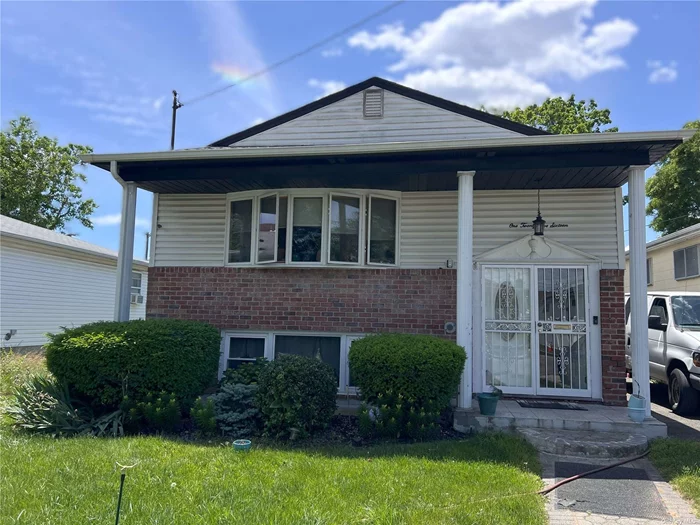 This beautiful split level ranch style home sits in Laurelton, New York. It has a living/dining room combo, 3 bedrooms, a lovely full finished basement with family room, central air, washer/dryer, solar panel, garage, and parking for 3 cars. Make this your home. Being sold as is.