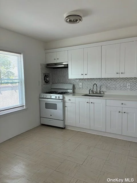 Featured 2 bedroom, 4 room apartment is located on the 2nd floor rear of the building on Jericho Tpke Newly renovated kitchen with marble counter top, new cabinets, new gas stove and refrigerator. The apartment has refinished hardwood floors and new blinds. Full bath. Newly painted. Separate entrance.