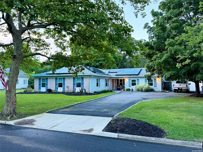 WELCOME HOME to this stunning 5 Bedroom 3 full bath ranch home on a lovely block in the Tangle Hills neighborhood. This home comes complete with not one but two newly renovated designer kitchens.  The home features a legal 1 Bedroom Apartment, all new windows, energy efficient System 2000 heating system, wood burning stove, quartz counters, stainless appliances Central Air conditioning. Other features include sewers, underground utilities, private flat backyard and much more.  Legal rental with active rental permit. Low Taxes $9, 880 with Basic STAR exemption. Act fast because this home will not last!