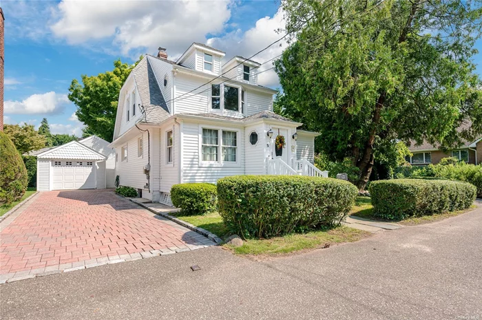 Charming Colonial on quiet dead end street. Spacious layout with hardwood floors, updated kitchen w/granite counter tops. large living room with built in bookcase. Main floor laundry. Andersen Windows. full unfinished basement w/outside entrance. Gas heat. Long paver stoned driveway to detached 1 1/2 car garage. Close to shopping. A must see!