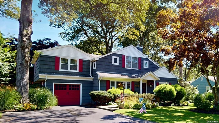 This 5 bedroom, 3.5 bath home is set on a beautifully landscaped property on a quiet street yet close to Main St amenities and near Moriches Bay! Very well constructed home with unique and charming architectural features including a huge living room with massive fireplace for family gatherings, recently renovated kitchen with marble counters, 2 bedrooms and bath on the main level as well as a laundry room. On the second level you will find a primary suite with bath and walk in closet, 2 additional bedrooms and a bath as well as an alcove that could be an office and more! There is also a full basement with high ceilings and an attached 1 car garage.