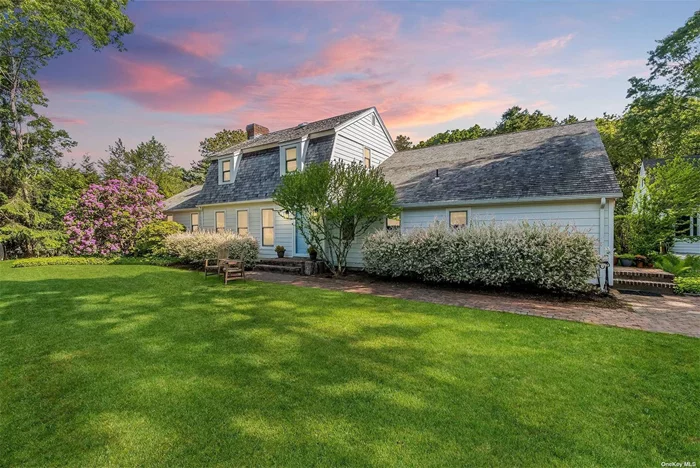 Discover a breathtaking oasis just outside East Hampton Village on Squires Path. This exquisite property offers seamless access to the Village&rsquo;s delightful amenities, from boutique shops and chic restaurants to the serene beach. Having undergone a meticulous renovation completed in 2023, this home is the epitome of style, comfort, and readiness. Boasting three spacious bedrooms, three full bathrooms, one-half bath, and over 3, 000 square feet of living space, including a finished lower level, this residence is designed for modern living. The contemporary floor plan features open living and dining areas, Anderson windows and glass doors, refinished hardwood flooring, and state of the art systems. The gourmet kitchen is a chef&rsquo;s dream with Kitchen Craft wood cabinets, quartz countertops, and top-of-the-line appliances, including a Sub-Zero refrigerator, Wolf range, and Bosch dishwasher. A new water treatment system was also installed during the renovation. Every detail of this home has been crafted with precision and care. The well-appointed bedrooms include a primary suite with a walk-in closet and an updated bath. The finished lower level offers a gym, two living/entertainment spaces, and a full bathroom. Outside, the expansive, manicured backyard overlooks a pond within the Town Nature Reserve. The outdoor space features a bluestone blend patio, firepit lounging area, custom outdoor lighting, a new heated gunite saltwater pool, and a pool house. Additionally, there is a 1-car garage with an electric vehicle charging station and a second-floor loft space, perfect for transforming into a stylish office. This stunning home, located in the desirable East Hampton Village Fringe, is a true gem waiting to be discovered.