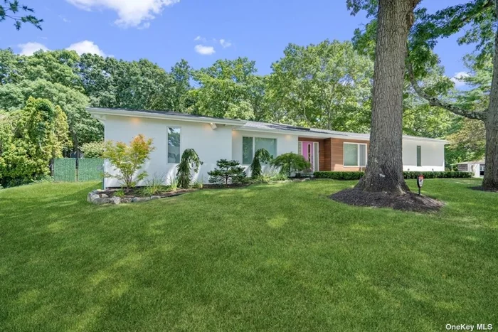 Desirable and sought after four to five bedroom ranch and set on one stunning acre, has a long private driveway, setting the tone of this Midcentury inspired home. Move in ready and timeless architecture, this home features an open concept with floor to ceiling glass, skylights, 5 white oak flooring and soaring ceilings to maintain an appealing nostalgic Midcentury design. A skylit entry and warm oak flooring lead into the primary living spaces. There is a formal banquet sized dining room which flows seamlessly into the butler&rsquo;s pantry with custom white cabinetry to the ceiling and quartz counter tops. A center island chef&rsquo;s kitchen has stainless steel appliances, to include: double oven, cook-top and microwave, custom-built cabinets to the ceiling, quartz counter-tops and center island seating space, plus under counter lighting and polished cement floors. True to a minimalistic clean, light and natural architecture. The breakfast area has sliders overlooking parklike property and inground pool. The den has multiple skylights, cathedral ceiling, gas fireplace and a large window streaming in natural light and joins the formal living room. A guest designer powder room has a beautiful floating vanity and is conveniently located off all the main living areas. A luxury primary suite has a walk-in closet with custom closet organizers, 4 panels of windows, automated window treatment, sitting area and a primary ensuite bath with frameless clear shower doors, separate jacuzzi tub, double linen closet, floating double vanity, radiant heat and a sliding door to rear deck. There are an additional three bedrooms all with large closets and oversized windows. The lower level has an office, finished rec area and half bath. This home would not be complete without an incredible rear property with specimen trees and perennial gardens. Completely fenced, this country club property features, a newly reconstructed salt water heated pool with waterfall feature, concrete custom color pool surround, maintenance free decking, outdoor led Lighting with app capability. Additional interior and exterior features include: alarm with remote access, new roof, new stucco exterior, gas heating, underground sprinklers: interior: new carpeting, new 5 white oak flooring, gas fireplace, radiant heat, jacuzzi bath, Wolf and Sub Zero appliances, new Andersen windows and doors, plus much more. This will not last.