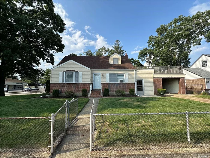 Welcome to this stunning one-family home in West Hempstead. This well-maintained property boasts an impressive four bedrooms and two bathrooms, A full finished basement with its own separate outside entrance and double sided garage that opens on both sides. The home features a newly renovate roof, ensuring long-term protection and peace of mind. Situated on a spacious corner lot measuring 113 x 101 feet, this home offers ample room for outdoor activities and a beautiful landscape.