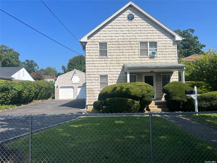 Bring your designer touch to this wonderfully built home, owned and loved by the same family since its construction in 1927. In 1990, the home was expanded to accommodate the owners&rsquo; needs, nearly doubling the square footage. The covered front porch welcomes you in to the living/dining area with its original hardwood floors. As you make your way past the large eat-in kitchen (EIK), you&rsquo;ll find a full bath and laundry room. The sun-drenched expanded family room is truly the highlight, offering a spacious and comfortable area where you can gather, entertain, relax, and create lasting memories. A first-floor bedroom/office adds to the convenience of the layout. The second-floor expansion in the 1990s added square footage, a full bath, and doubled the primary bedroom space with two walk-in closets. Also on the second floor are three additional bedrooms and access to a pull-down attic, providing ample room and storage. The full unfinished basement houses a natural two-zone gas heater, a new gas hot water heater, an updated 220V electrical panel, and an exterior entrance to the rear yard. The large barn-style two-car detached garage with a walk-up storage loft and an oversized driveway is the icing on the cake for this well-built home. The home is perfectly located for quick access to highways, LIRR, bus stops, five-star restaurants, schools, parks, private beaches, and golf courses-all for the enjoyment of Glen Cove community homeowners. The appliances are not included in the sale, which is reflected in the pricing. Let this be where your story begins, just as it was for the family who has lived here for nearly 100 years!