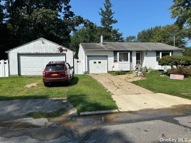 Sprawling, 3-bedroom ranch features all hardwood floors throughout. Gas heat. Full basement with outside entrance. Spacious EIK, fireplace, total 3 car garage, 2 detached and has 100 amp service. Full attic with fans. Located on a dead end. Close to all