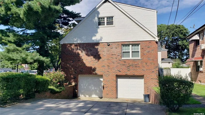 A Rare Jewel of a home in Flushing, A custom corner lot two-family detached home with 2 car garage. Fully finished basement with a side entrance, Tranquil private backyard patio ideal for entertaining, gardening or unwinding, Nearby to restaurants, parks, stores, church, and public transportation, including Q15, Q16, LIRR, 7 train