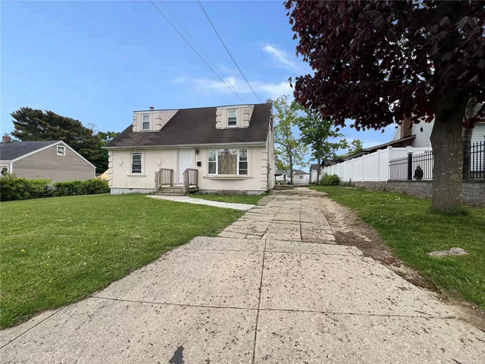 Introducing the 4 bedroom 2 bath Cape with a full basement. This is located in a residential area on a flat lot with a nice back yard. This is a must see, this has a huge potential.