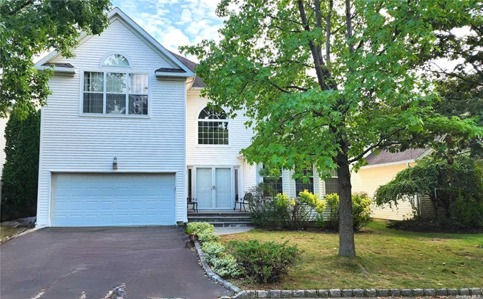 This elegant and spacious colonial Located in the desirable Half Hollow Hills School district features five bedrooms & three and a half baths. The grand two-story foyer opens to a generous interior featuring hardwood floors and large windows. First floor features the luminous living room and dining room, Spacious EIK opening into the family room with sliding doors to the backyard, powder room, bedroom/ office w/ full bath. Second floor features large landing , primary bedroom w/primary bath and three more large size bedrooms, hall bath, and laundry room. Additionally, the finished basement offers extra living space perfect to entertain and plenty of storage options. Step outside to the backyard with paved patio for outdoor entertainment. The private driveway leads to a two-car garage, providing ample parking. This impressive home is located in a highly sought-after central Long Island in A Gated Community - Country Pointe with 24- hour security, tennis court, pickle Ball Court, padded playground, basketball court, pool, club house with 24/7 access to fully equipped gym and card room. HOA is 339 per month.