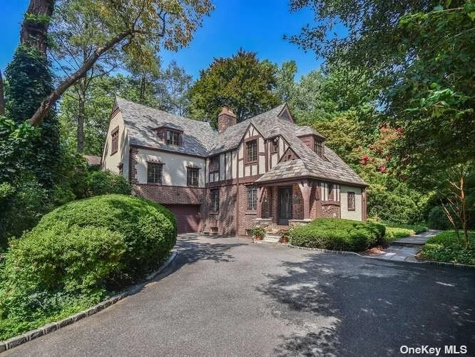 Don&rsquo;t miss your chance-Price Improved!! Beacon Hill Storybook Tudor with Modern Luxury; This very special 4-bedroom, 3.5-bath Tudor home, thoughtfully renovated in 2015, offers an exceptional blend of historic charm and contemporary sophistication. With its freshly painted stucco and half-timbered facade, rejuvenated Vermont slate roof, and restored stained glass and casement windows with handcrafted griffons, the property exudes character and quality. Inside, enjoy a large modern kitchen designed by a professional chef and dietitian, featuring a spacious center island, generous counter and cabinet space and luxury appliances from Wolf, Bosch, and GE Monogram. Additional amenities include a pot filler, multiple ovens including steam and convection, ensuring a top-tier culinary experience. Add to that an Aquapure water filtration system for added purity. The generously sized living room, showcases a wood-burning fireplace and architectural beams. Each of the four bedrooms is well-proportioned and offers recently renovated adjoining or ensuite bathrooms. The lower level features a welcoming entertainment space and a large laundry area with additional pantry storage and LG appliances. A convenient rear entry hall provides easy access for muddy days and pets. This home boasts energy-efficient multi-zone mechanical systems, gas heat, French drains, sump pumps and a full-house generator for added peace of mind. Additional features include a heated two-car garage, central vacuum system, and Cat5 wiring. Step outside to enjoy beautifully landscaped grounds with multiple slate patios and stone walkways. The 1/3-acre property is a gardener&rsquo;s dream, a haven of native plants that require minimal maintenance and water while offering year-round beauty and privacy. Located on a quiet, mid-block street in Beacon Hill, this home provides easy access to town, trains, schools, and offers beach rights and kayak storage with a $200.00 annual fee. With too many features to list, this rare find is a must-see.