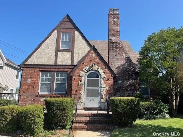 Welcome to this charming 4 BR plus office, South facing Tudor home. -From the moment you cross the threshold, you feel the love & warmth that fills this brick/stucco home. Enjoy the lovely formal living room whose focus is on the rustic wood burning fireplace. Cook delicious meals in the kitchen , and dine in the adjacent dining room. The first floor has 2 bedrooms, a full bath. Upstairs are an additional 2 bedrooms plus office, and additional half bath. This gas heated home has stunning hardwood floors throughout. 1 Car detached garage on a 50x100 private lot . The basement has a side entrance and offers tons of possibilities. Burner replaced 2017, Flood ins. $1040/yr Baldwin SD- Put your GOLD lock on it!