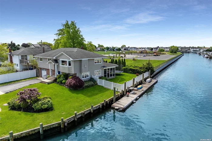 Discover your dream home in prestigious Massapequa Shores! This meticulously maintained Hi-Ranch features stunning water views from each room and boasts 100ft of bulkhead on a wide canal, ideal for boating enthusiasts. Located at the end of a quiet cul-de-sac and adjacent to Anchor Park, this home is perfectly appointed and offers unparalleled privacy and serenity. Features include 3 generously sized bedrooms, a large eat-in kitchen with vaulted ceilings, and an open-concept floor plan, perfect for entertaining. Relax by the gas fireplace or in the enclosed patio, accessible from the fully finished basement. With two modern bathrooms, hardwood floors, and stainless steel appliances, this home combines luxury and comfort in every detail. Don&rsquo;t miss the opportunity to make this gorgeous Hi-Ranch in Massapequa Shores your own!