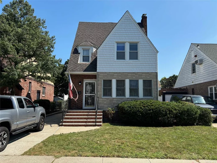 2.5-story Colonial with finished walk up attic room and full partially finished basement. Wide driveway with garage. Polished oak wood floors, formal dining room