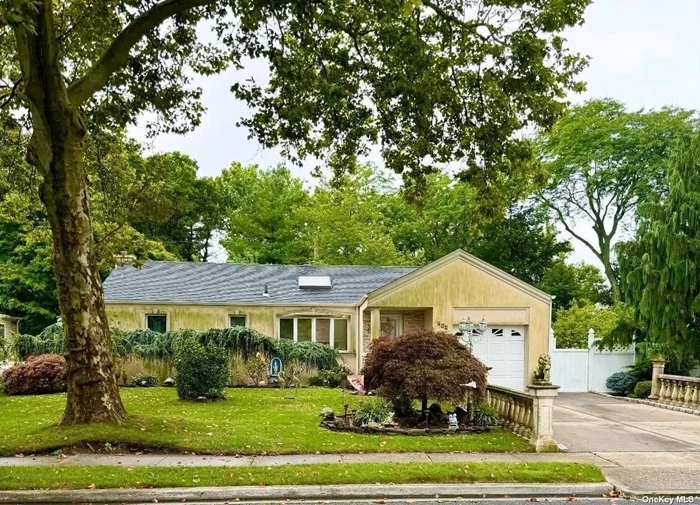 Three Bedroom, three bath ranch on a tree lined street, mid block location