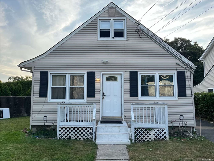 Living room, kitchen, one full bathroom, two bedrooms on main floor. Two bedrooms on upper level. Unfinished basement with washer and dryer hookup as well as a full bathroom and additional storage space.