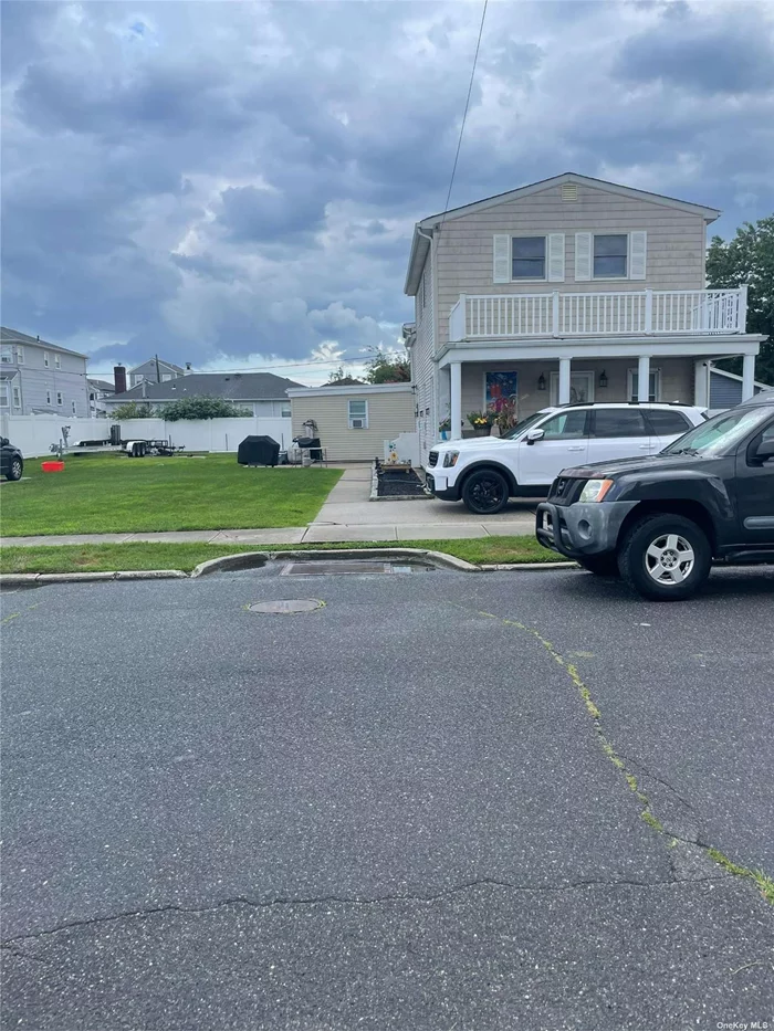 Legal 2 family house, 3 BRM 1 Bath over 3 BRM 2 Baths on over sized lot. Washer/Dryer in both units. Separate meters. Sprinkler system, gas heat. Taxes $11, 611. 5 minute drive to beaches. Short walk to LIRR.