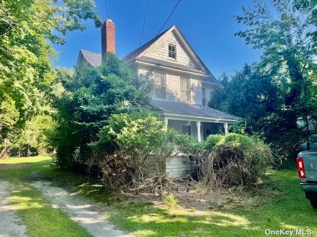 Nestled on 1.4 Acres, this Charming Victorian home boasts approx. 2500 Sq Ft of potential. With its intricate woodwork, Gable roof lines The property captures the elegance of a bygone era. Inside High Ceilings, Original hardwood floors throughout, and vintage details await restoration to their former glory. The expansive grounds offer endless possibilities, including a two-stall barn perfect for horses, Hobbies, or storage. Additionally, the property offers room for a potential riding ring, or a unique opportunity for a possible subdivision, providing a chance for future development or investment. This home is a canvas for your vision, requiring work but brimming with Historic Charm and Potential.