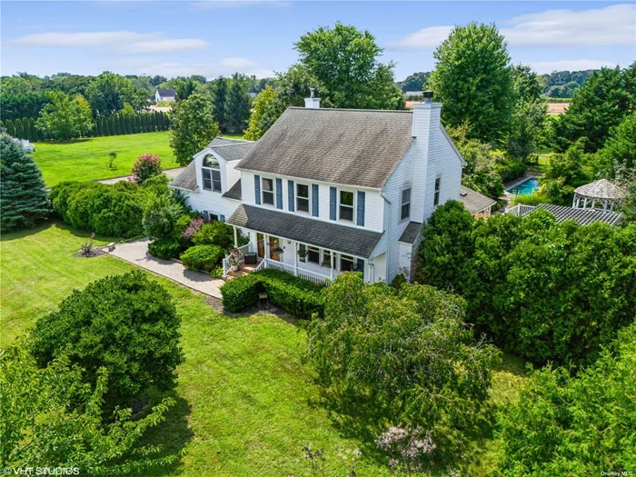 Experience the best of the North Fork in Mattituck! This expansive residence offers breathtaking views over preserved farmland and incredible sunsets. Located in the heart of the North Fork Ag Belt, this property is just moments away from Love Lane shopping, renowned vineyards, top-tier restaurants, sugar sand beaches, and marinas offering boating and other activities. The well-cared for home features a charming front porch, living room with wood-burning fireplace, eat-in kitchen/dining room, sunroom/den, and expansive decking, perfect for entertaining. Upstairs, enjoy a substantial owner&rsquo;s suite with a full bath, walk-in closet, and private west-facing balcony for sunsets, plus 3 additional bedrooms and a hall bath. Recent updates include an oversized &rsquo;Roman&rsquo; pool, hot tub, and private lawn areas, offering the perfect setting for relaxation and entertainment. With plenty of room for gardening and a cheerful, sunny location, this property is a new addition to the North Fork market, offering you the opportunity to have it all.