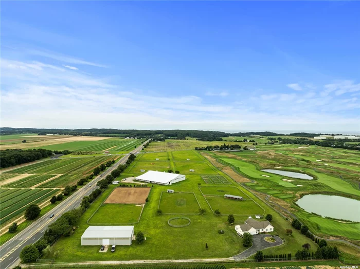 North Fork Classic Dreaming of privacy, open space and forever vistas? This equestrian turnkey facility offers all this and more. 28 acres of fenced pastureland and paddocks. 24 stall barn with attached indoor arena for your year-round riding enjoyment. Additional 4 stalls in a mini barn. Equipment storage barn and beautiful modern ranch style home built in 2012! Ideal location for nursery, field crops or vineyard. Escape to this incredible place and call it home!