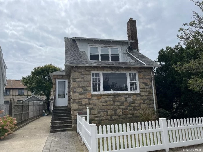 Long Beach East End -- One family colonial home with yard and off street parking driveway--The main floor features a foyer leading into the living room with fireplace, then onto formal dining, both with parquet floors. Work in Kitchen, spacious den and full bath,  The second floor has 3 bedrooms and 2 full baths, ( an en-suite with walk-in-closet ) There is a full basement with washer/dryer and room for storage, Plus there is a pull down staircase to the attic, ample parking in the driveway, yard, minutes to the beach. Being Totally Repainted & Re-carpeted (HARDWOOD FLOORS AS SHOWN).