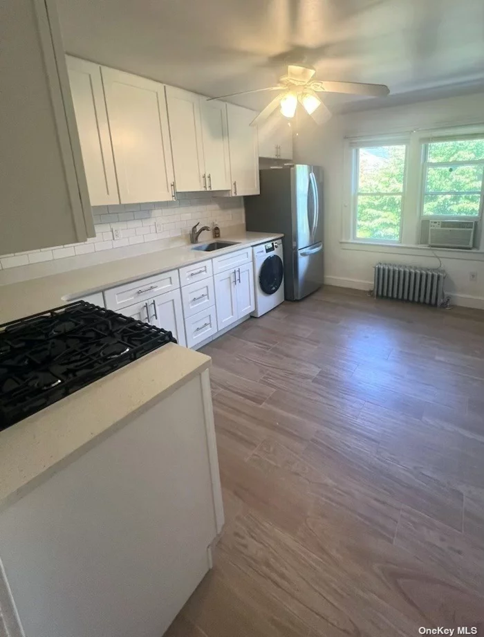 Newly updated apartment. new kitchen cabinetry and appliances. New washer and dryer. Hard wood floors. Walking distance to shopping and train.