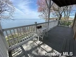 Stunning Year round Water views from this 2 bedroom apartment. Watch the sunset from your private balcony. Unique carved wooden doors throughout. Updated Kitchen. Lots of storage space. Shared washer and dryer. Walk to beach, village and train.