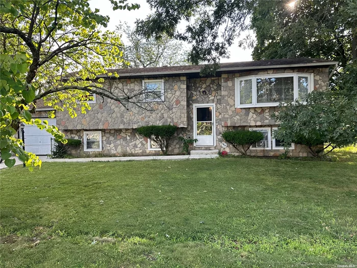 Welcome to this exceptional Hi-Ranch property in Wyandanch, New York. It&rsquo;s Lot size spans an impressive 12, 000 square feet. Set on a beautifully maintained lot with lush lawns both front and back. You are first greeted by the newly installed 6 Cars Driveway and 1 Car attached Garage. The noticeable large Bay Windows are hard to ignore just before entering the property with freshly painted walls throughout. It flows into the spacious family Living/ Dining room with original Hardwood floors. Beside dinging area is a well-sized Eat-in-kitchen and fully equipped. To the Left of Hallway with - Full Bathroom, three spacious bedrooms (King, Queen and Full with spacious Closets). On the Next Level - the possibilities are endless! 2 large open concept rooms/ hallway, room, Boiler room, Laundry room and a Full Bathroom. Don&rsquo;t let the this great investment pass you by.