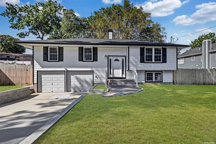 Discover this fully renovated hi ranch home in Ronkonkoma, where modern updates meet classic charm. The first floor offers versatility with an office, cozy den, 2 spacious bedrooms, and a full bathroom, all complemented by an outside entrance for added convenience. The second floor welcomes you with an inviting living room featuring a warm fireplace, a formal dining room, and a bright eat-in kitchen, perfect for gatherings. Three additional bedrooms and a second full bathroom provide ample space for family and guests. Completing this move-in-ready home is a two-car attached garage, offering plenty of storage and parking. This beautifully updated home is ready to welcome its new owners!