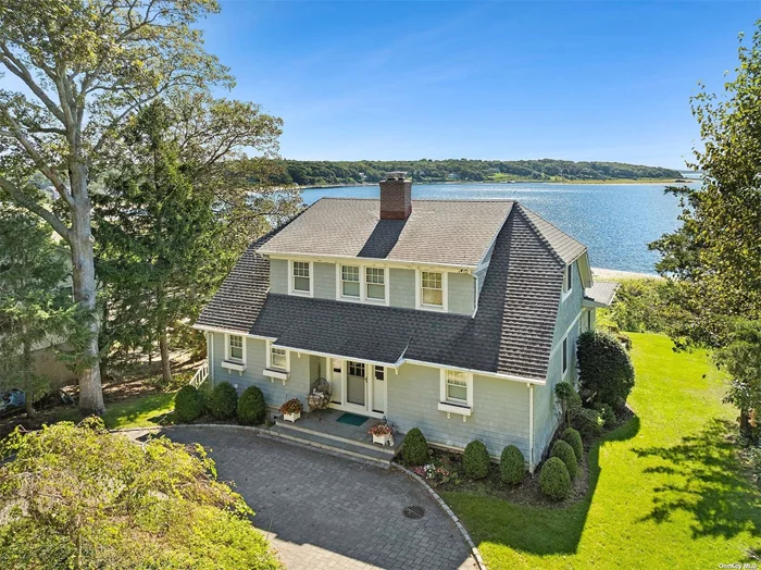 This exquisite waterfront home in Fleet&rsquo;s Neck, custom-designed by Samuels & Steelman, boasts stunning cedar shake architecture and offers breathtaking views of the bay along with direct beach access. Bathed in natural light, the open living areas are ideal for both relaxation and entertaining. The expansive sunroom provides panoramic water views, and the first-floor primary ensuite suite features water views and a walk-in closet. Additional bedrooms also enjoy full water vistas. Outdoor living is enhanced by a waterfront deck, a patio, and a walk-out basement, perfect for an office or recreational space. This home includes central air conditioning, five heating zones, a generator, and a spacious freestanding two-car garage with ample additional storage. Experience the perfect blend of comfort and waterfront charm in this exceptional home-your idyllic escape awaits!