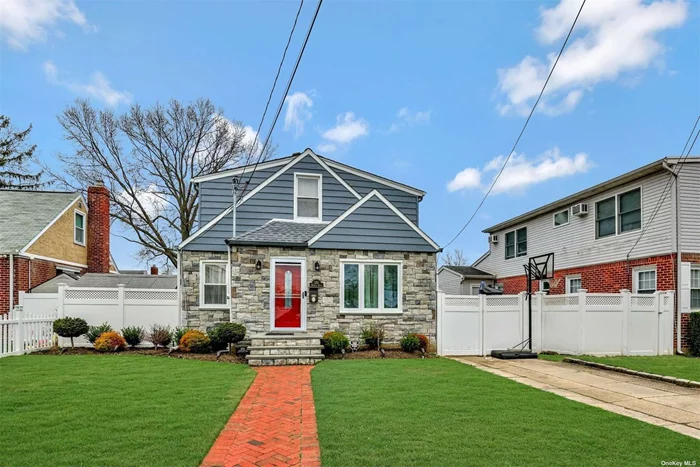 This home features hardwood floors, beautifully updated kitchen with stainless steel appliances, 2 updated bathrooms, a modern electric fireplace, and 4 bedrooms. The basement is a finished space with a separate entrance. This home also offers a washer & dryer, use of yard, and driveway parking. Truly a must see!