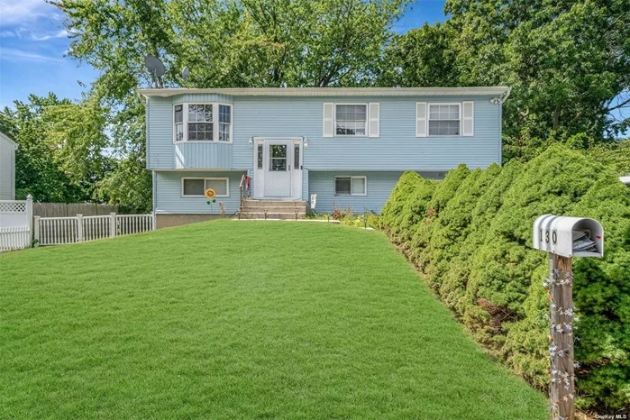 Welcome to this inviting 5-bedroom, 2-bath hi-ranch featuring an eat-in kitchen and a formal dining room, perfect for gatherings. The second-story balcony offers a serene view of the large, fenced yard, ideal for outdoor enjoyment and relaxation. This home combines comfort and functionality, making it a perfect choice for your next move.