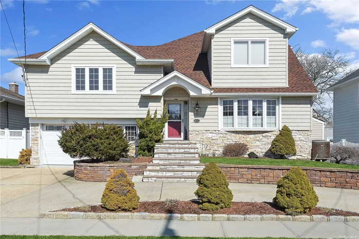 This split level home in Lido Beach, NY is flooded with natural light due to its southern exposure. Currently situated as a 3 bedroom, but can be easily converted to a 4 bedroom with 3 full bathrooms Enter into the bright living room with built in bookshelves followed by the open kitchen and dining/den area. The two secondary bedrooms are separated from the primary suite by a spacious multipurpose room. All three bathrooms has been recently renovated along with the top two levels of the house. The primary suite has cathedral ceilings, a large walk in closet, a huge bathroom with double vanity and separate tub/shower, and a Romeo & Juliet balcony with views of the bay and NYC skyline. Tons of storage between the attic and attached garage. Conveniently located near the beach, parks and bus transportation, plus it neighbors the City of Long Beach, known for its restaurants, stores and lively environment. Come see if this home is the perfect fit for you!Flood Insurance Currently $1918 Per Year