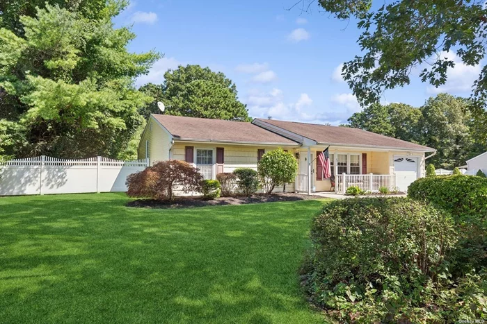 Bordering Farmingville, In a lovely cul-de-sac, sits this beautifully landscaped pristine expanded ranch.. The living room has very high vaulted ceilings, leading into a den with a wood burning fireplace. An addition, added a large entertainment room and dining room both with vaulted ceilings. The primary bedroom is en-suite with a newly renovated bathroom. There are 2 additional guest bedrooms. One is currently used as an office. The other full bathroom has been beautifully renovated. The backyard is fenced, with a shed, patio, and a 27 ft. above ground pool which is a gift.