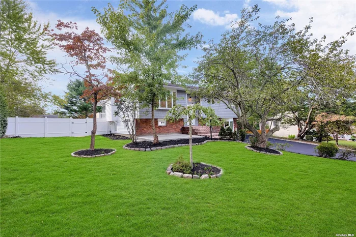 Welcome to this stunning Hi-Ranch in the heart of Smithtown featuring 5 bedrooms and 3 full bathrooms. This home has been completely updated to offer a modern, open floor plan. The eat-in kitchen boasts stainless steel appliances, quartz countertops, and a view of the spacious, beautifully landscaped backyard-perfect for entertaining. Enjoy the warmth of beautiful hardwood floors and the abundance of natural light from the new windows throughout. The home also includes updated electrical systems, Central air conditioning, and a unique charm that sets it apart. The lower level offers two large family rooms and additional bathroom providing endless possibilities for customization to fit your needs. OSR with a bonus for Mother/ daughter. The privately fenced backyard is both spacious and meticulously landscaped. Conveniently located close to highways, shopping, malls, and public transportation, this home combines comfort and convenience. Don&rsquo;t miss the chance to make this exceptional property your own-it won&rsquo;t be on the market for long!