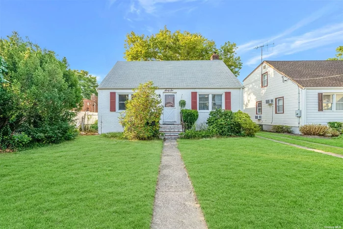 Welcome to this beautifully expanded Cape Cod home in the highly sought-after Hewlett-Woodmere School District! This charming residence boasts 3 spacious bedrooms and 2 full baths, perfect for comfortable living. The main floor features a convenient bedroom, while the second floor offers two additional bedrooms, including the expansive primary suite. The primary bedroom, located on the second floor, is large enough to accommodate a king-sized bed, a cozy sofa, and additional furniture, with plenty of space to spare. Enjoy the luxury of an en-suite bathroom featuring a skylight that bathes the room in natural light. Hardwood floors run throughout the home, adding warmth and elegance to every room. The heart of the home is the expansive family room, located just off the kitchen, offering seamless indoor-outdoor living with patio glass doors that open onto a lovely deck-perfect for entertaining or enjoying a quiet moment in the fresh air. The formal living room is a delightful space with built-in shelves that add both charm and practicality. Adjacent to the living room, you&rsquo;ll find a formal dining room, complete with a closet for added storage. The large basement provides even more space with a variety of functional rooms, including an office, a den, a laundry room, a cedar walk-in closet, and a pantry-ideal for all your storage needs. (Upgraded 200 amp service). This home features new windows in most areas, ensuring energy efficiency and a bright, inviting atmosphere throughout. The driveway is spacious enough to fit 4 cars easily, adding to the home&rsquo;s convenience. Located near public transportation and JFK airport, commuting is a breeze with a 39-minute train ride to Penn Station, making this home not only beautiful but also incredibly convenient. Don&rsquo;t miss the opportunity to make this delightful expanded Cape your home!