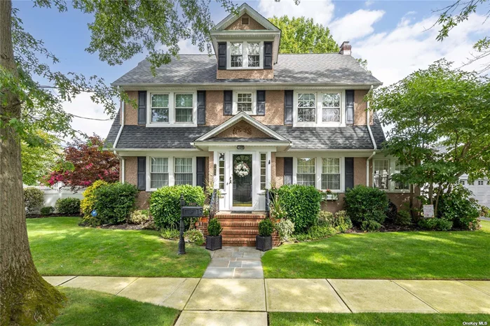 Class and style abound as you enter this stately 5 bedroom, 2.5 bath Dutch Colonial Revival built in 1927, with an addition circa 1951. The home has been meticulously maintained; old world charm meets modern day amenities, not a detail overlooked! White oak floors with double mahogany inlay throughout accent the substantial formal living room, centered around a natural gas fireplace with original onyx hearth from the 1920s. Adjacent to the living room is a sunroom offering a bounty of natural light. The elegant formal dining room, reached through a roomy foyer, leads to a nice-sized, updated eat in kitchen with pantry. The immense family room features a cathedral ceiling, plenty of windows, a powder room, and access to the attractive backyard, perfect for entertaining! The second floor comprises all the contemporary conveniences such as a washer/dryer, cedar storage, an exquisitely remodeled bath with oversized jacuzzi tub, and three of the five bedrooms. The primary has an ensuite, three closets, and additional storage within a beautiful window seat. The third floor contains the remaining two bedrooms and provides even more storage. The home is set forward on its plot to maximize the park-like property with ornate, mature trees, a sizable bluestone patio, and a detached two car garage. There is an 1, 800 square foot unfinished basement as well offering endless possibilities. All renovations were completed with the integrity of the home in mind. This is a special opportunity in the desirable Seaford Manor neighborhood. Truly one of a kind!