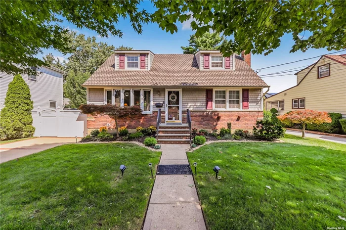 Expanded Cape at top location on quiet, peaceful street. This is a true mother/daughter layout, with a potential separate living area on second floor. First floor consists of large LR, formal DR, EIK, two BRs, full bathroom, and sunroom/family room, with entrance to deck and gorgeous, huge backyard, complete with patio and lots of space. Second floor has its own kitchen and full bathroom, living room, and 2 bedrooms (wall was recently removed to create single extra-large bedroom). Full finished basement with own separate entrance and high ceilings includes large open recreation room, bathroom, and laundry room, huge storage space, and additional room. 60x100. Gas heat. House is in excellent condition and is very well maintained. Situated mid-block with manicured grounds, private driveway. Very short walk to LIRR. This is a wonderful home to raise your family!!!