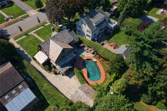 Situated on a quiet street with mature trees and charming homes, this classic brick English Center Hall Colonial exudes elegance and charm. The south-facing property is bathed in sunlight, creating a bright and inviting atmosphere throughout. Traditional first floor offers a wonderful flow with formal living room and dining room, exercise room, and a cozy sitting room. The updated kitchen boasts abundant countertop space, high-end appliances, and additional areas perfect for entertaining. Upstairs, the primary suite features a luxurious spa-like bathroom and ample closet space. Two oversized bedrooms and a full bath complete the second floor. The third floor includes a spacious bedroom with generous walk-in storage.The exterior is perfect for entertaining, set on a generous 75 x 150 lot with a pool, hot tub and a bluestone slate patio. The beautifully landscaped grounds provide a private oasis for relaxation and recreation.