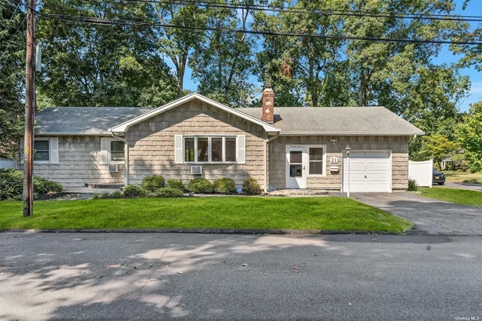 3 br 2 bath expanded ranch in Huntington station. 1 car garage with access into home from garage. corner lot, on .18 acres, close to all! 2 separate entrances, 2 fireplaces, deck off back of house with 2 sliding glass doors. Hard wood floors throughout.