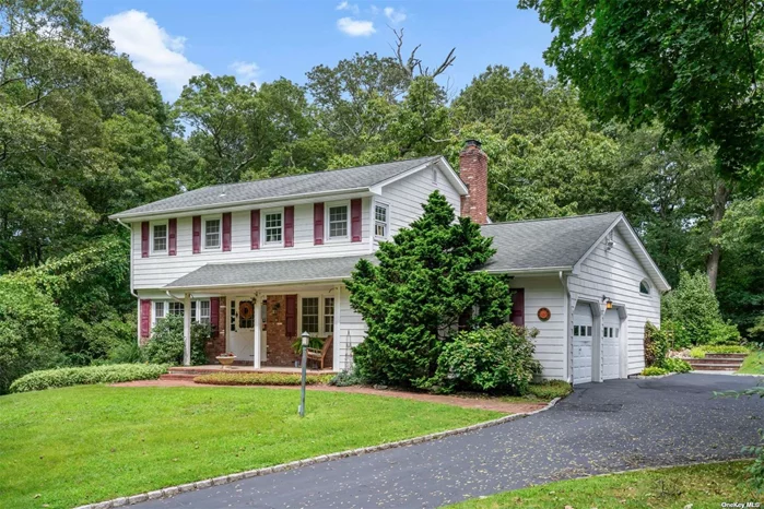 Welcome to this charming 4-bedroom, 2.5-bathroom Colonial, perfectly situated in a serene private cul-de-sac, nestled on over an acre of land. The bright living room boasts 2 large picture windows on both the front and back side of the house. The kitchen features stainless steel appliances, a counter with seating and wrap around storage that conveniently opens to the dining area, creating an ideal flow. Adjacent to the kitchen is the gracious family room, featuring a vaulted ceiling with 2 new skylights, beautiful brick wall wood-burning fireplace and an oak custom-built entertainment center. The gracious primary suite offers an oversized double closet with custom built-ins and a newly updated bathroom. With the expansive property and private location, this home is a rare find that offers both privacy and opportunity.