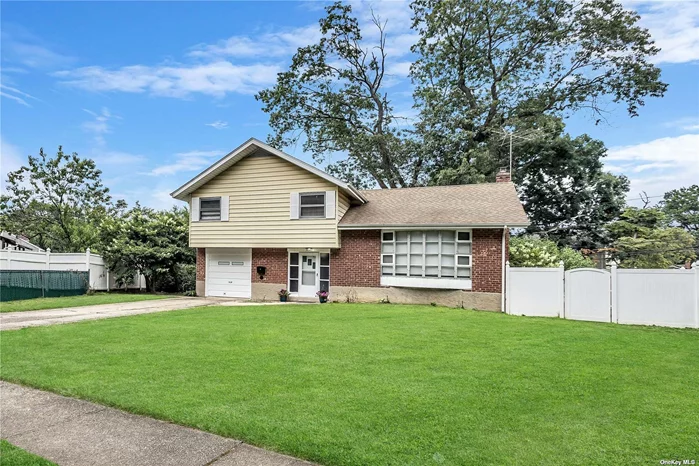 Welcome to 32 Northcote Rd. A lovely split-level, single-family home built in 1958. It features 4 bedrooms, 2 updated bathrooms & 2 half-baths, sits on a 0.20-acre lot, finished full basement, and offers 8 rooms in total. Key features include hardwood flooring, an updated eat-in kitchen, a formal dining area, large living room with a Cathedral ceiling. The exterior of the home is a mix of brick and vinyl siding, and it offers private parking. The heating system is natural gas with hot water. The property also includes appliances like a washer, dryer, dishwasher, and refrigerator. Can be Mother/Daughter with proper permits. Taxes are without Star Exemption!