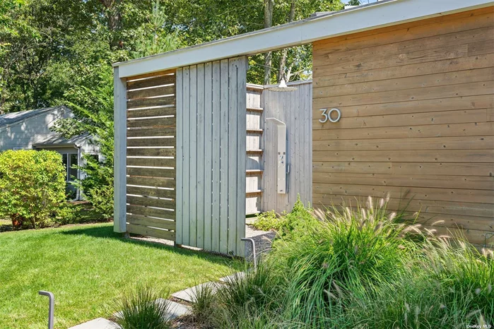 Modern Courtyard House available for sale in the beach community of Pine Neck, Sag Harbor. Built in 2019, with significant upgrades added, this light-filled, 4-bedroom, 3 1/2 bath home is purposely designed and concepted around a sunny central courtyard and constructed on-site with highly efficient SIP modular panels with a standing seam metal roof and Pella insulated windows and doors. The 2020 addition of a 17 &rsquo;x 11.5&rsquo; heated saltwater Gunite plunge pool and an extensive and naturalistic planting schematic ooze Hampton&rsquo;s sophistication and style, creating a peaceful oasis close to Sag Harbor Village and Long Beach. With an exceptional rental history, the house spans over two levels; the 1500 +/- sq ft main level features an open plan kitchen, dining, and living area, including a cozy gas fireplace and three ensuite bedrooms, with an additional 1350 +/- sq ft lower level, which was finished to include a 4th bedroom, a full bath, office, laundry room, entertainment room, and wet bar. There is also a storage room, with exterior access through Bilco doors, and a separately designated mechanical room. Additional features include custom California Closets in all bedrooms, 4 SMART TVs, WIFI extenders, and a central vacuum system. An outside shower and gas fire pit patio, surrounded by irrigated grasses, evergreens, shrubs, and diffused light, complete the ambient picture.