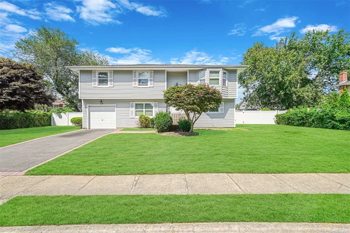 Step right into this Bay Shore Hi Ranch with room for mom. Features 4 bedrooms 2 full baths, Living room, Dining room, Kitchen with access to Deck . Updated siding and roof under 10 years , Flooring and Carpets changed 2021, All Windows and Sliding doors changed early 2024 !!