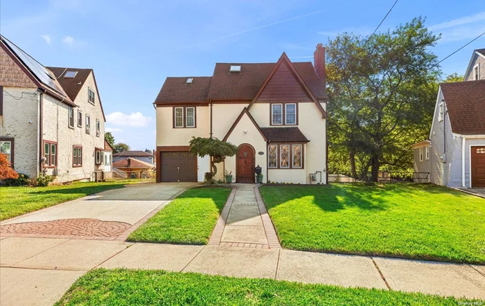 Welcome to this delightful Tudor-style home located in the Country Club Estate section. This home is approx. 3000 sq. ft. including unfinished basement on a generous 7, 670 sq. ft. over size lot. Featuring 3/4 spacious bedrooms and 3 Full bathrooms, this residence provides ample room for entertainment. The full, unfinished above ground basement with an outside entrance presents a fantastic opportunity for future expansion or customization. The finished attic includes a loft with easy access through a separate garage entrance. The layout of this home can have potential rental income with proper permits. The oversized lot is perfect for adding a pool or other outdoor amenities, making it a great space for outdoor enjoyment. With its classic Tudor architecture and potential for personalization, this home is ready to be your dream home or a great investment property.