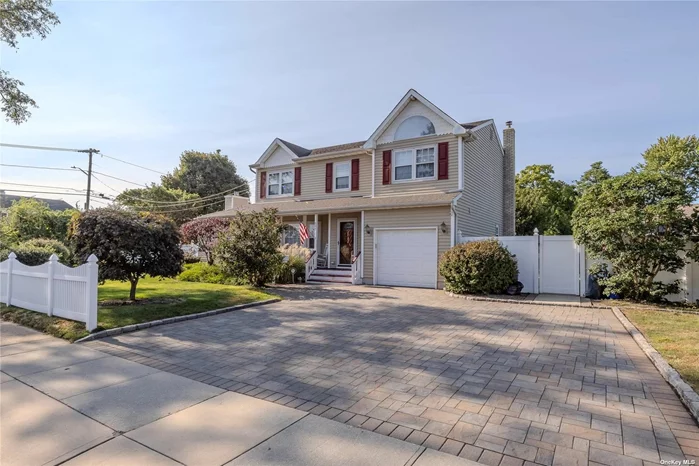 WELCOME HOME to 507 Grand Boulevard! This stately colonial boasts updated roof, windows, and siding; brand new SS appliances PLUS room for mom! Gleaming oak floors throughout the 1st floor and brand new LUSH carpeting keep the 2nd floor warm and inviting. Cathedral ceilings on BOTH levels let in SO much natural light! Wood-burning fireplace in the great room will keep new homeowners feeling cozy on cold winter evenings. Bedrooms feature large closets with built-ins! There is even a Jr. Primary bedroom with 2 large closets! The Primary suite is an oasis for new homeowners, featuring more cathedral ceilings, spa-like master bath and spacious walk-in closet. The new paver patio (driveway was also recently redone!) is perfect for new owners who love entertaining! Privacy and serenity abound in the sprawling, fully fenced backyard! Wifi-capable in-ground sprinklers make lawn care a breeze! The finished basement with summer kitchen is perfect for hosting extended guests. Meticulously maintained - inspection for informational purposes only. 5 minutes to mass transit, less than a mile from Geiger Park, and less than 1 mile to Tanger Outlets. This gorgeous property is perfectly located 15 minutes from downtown Huntington AND Babylon Village! Come see this home before it&rsquo;s gone! EVERYTHING you need AND a white picket fence!