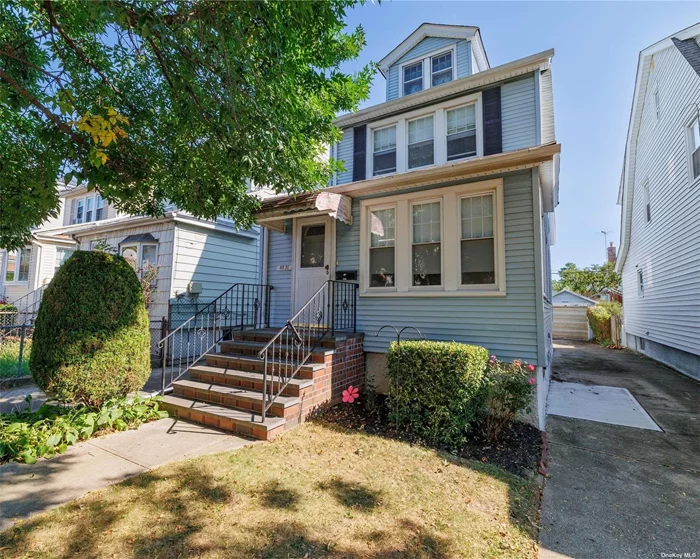 Welcome to this wonderful, sun-filled one family home in Queens Village! This lovely classic Colonial has everything you have been looking for. Convenient location a half block to Hillside Avenue, public transportation and just blocks to the Clearview Expressway and Springfield Boulevard. First floor features an enclosed porch as you step inside, then gorgeous original parquet hardwood flooring in the large living room and formal dining room. There is a large eat-in kitchen, half bath and washer/dryer. Second floor has three generously sized bedrooms, a full hall bath and stairs to a huge attic with fantastic potential. Full, unfinished basement has gas boiler/HWH. Located on a lovely block, this home even boasts a long private driveway and a one car garage. Make this your new home!