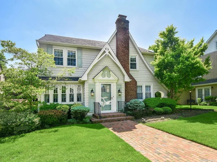 Pristine, beautifully appointed 4 BR Colonial in Rockville Centre. The heart of the home is the large, updated Eat-in-Kitchen adorned with custom cabinets, granite counter tops, and an additional island with sink, closets, storage and dishwasher. Laundry, Powder Room, Living Room w/fireplace, raised Family Room, Formal Dining Room. The upstairs boasts a Primary Bedroom with Primary Bath, 3 additional Bedrooms and a Full Bath. Walk-up attic, Full, partially finished Basement with Bilco doors to back. Central Air Conditioning, Oversized Garage / Deck with gas grill, full paver driveway& porch