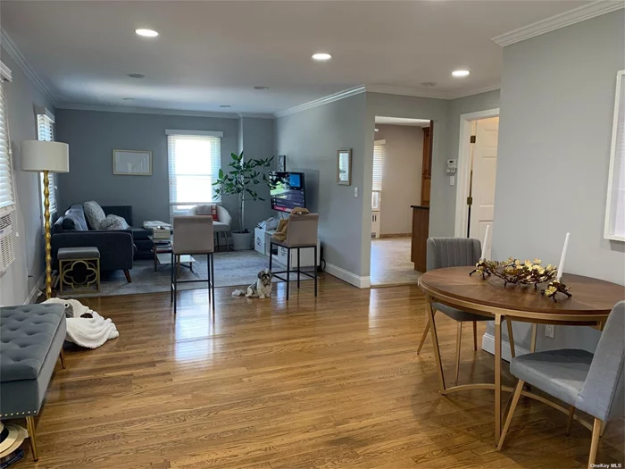 This spacious second-floor apartment at 15 Barlow Avenue in Glen Cove boasts abundant natural sunlight and hardwood floors throughout. The unit includes a king-sized bedroom, a full bathroom, and an open-concept living and dining room. The eat-in kitchen is fully equipped with a dishwasher, fridge, freezer, and microwave. Additional features include a new LG washer and dryer and a versatile loft space. Enjoy beautiful views from the private deck on the second floor. Conveniently located near public transportation, Glen Cove&rsquo;s train station is a short distance away for easy commuting.