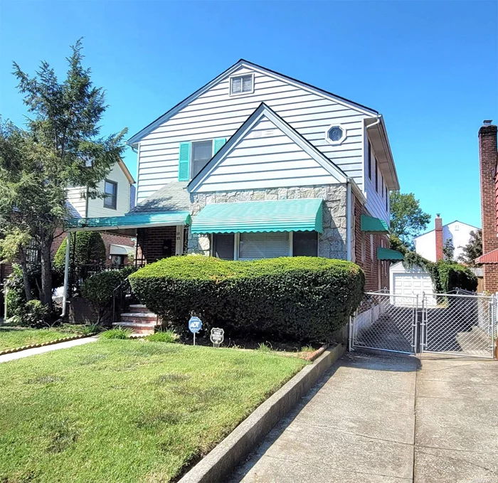 Single family house, fully dormered on both sides, featuring 6 Large bedrooms, 2.5 bathrooms on a 40x100 lot in the heart of Cambria Heights. 2bedrooms on the first floor along with full bathroom, Kitchen, Formal Dining Room, and Living Room. The 2nd floor features 4 very large bedrooms and a full bathroom. From the 2nd floor is pull down staircase to the full attic. There is a full basement, partially finished, with a half bathroom. New boiler, hot water tank and electric, otherwise the house is being sold AS IS. Outside is a front porch and in the back, a one car detached garage and enclosed patio. Near public transportation and shopping.